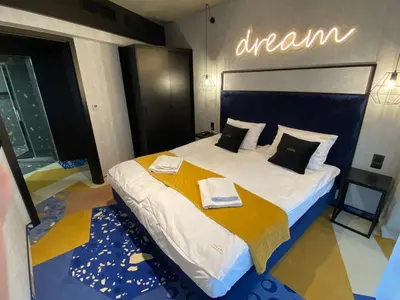 Łóżko lub łóżka w pokoju w obiekcie Bike Park & Spa Czarna Góra Resort
