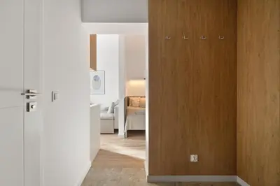 Łóżko lub łóżka w pokoju w obiekcie COMFISTAY Ozimska 55 - City Access and Free Parking
