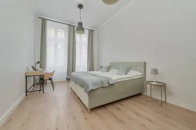 Łóżko lub łóżka w pokoju w obiekcie Piłsudskiego Stylish Apartment by Noclegi Renters