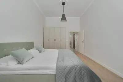 Łóżko lub łóżka w pokoju w obiekcie Piłsudskiego Stylish Apartment by Noclegi Renters