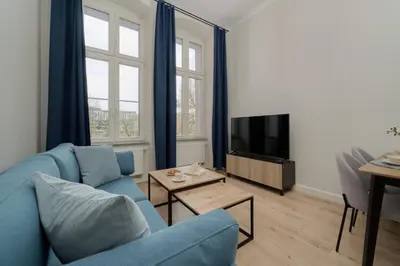 Telewizja i/lub zestaw kina domowego w obiekcie Piłsudskiego Stylish Apartment by Noclegi Renters