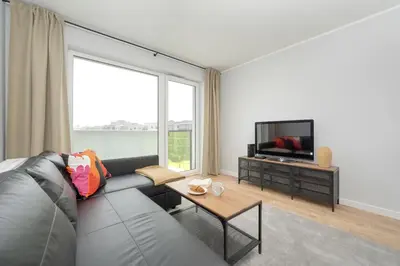 Telewizja i/lub zestaw kina domowego w obiekcie Pleasant Decor, Balcony & Parking Wrocław by Noclegi Renters