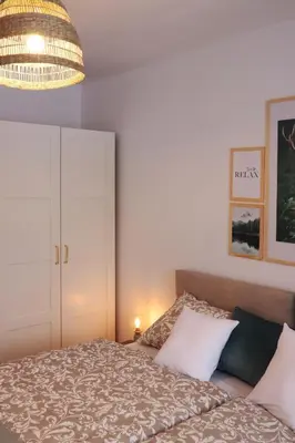 Łóżko lub łóżka w pokoju w obiekcie APARTAMENT Pod Lasem Jedlina Zdrój