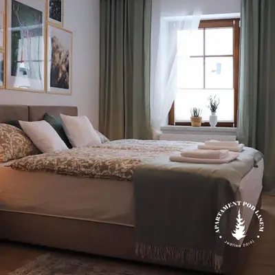 Łóżko lub łóżka w pokoju w obiekcie APARTAMENT Pod Lasem Jedlina Zdrój