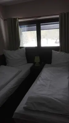 Łóżko lub łóżka w pokoju w obiekcie Zajazd Pod Niedźwiedziem
