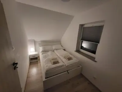 Łóżko lub łóżka w pokoju w obiekcie Sosnowe Wzgórze - Wypoczynek w Zagórzu Śląskim 1