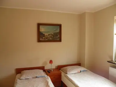 Łóżko lub łóżka w pokoju w obiekcie Pensjonat Zofia Demska