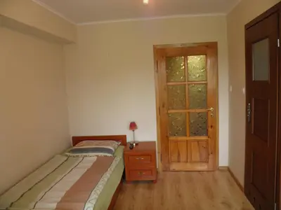Łóżko lub łóżka w pokoju w obiekcie Pensjonat Zofia Demska