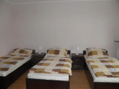 Łóżko lub łóżka w pokoju w obiekcie Pensjonat Zofia Demska