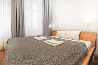 Łóżko lub łóżka w pokoju w obiekcie Komfort 2 pokoje obok Rynku