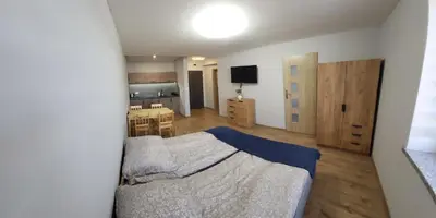 Łóżko lub łóżka w pokoju w obiekcie ApartHotel11