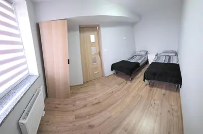 Łóżko lub łóżka w pokoju w obiekcie ApartHotel11