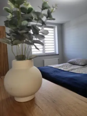 Łóżko lub łóżka w pokoju w obiekcie ApartHotel11