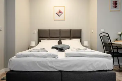 Łóżko lub łóżka w pokoju w obiekcie Wąska 5 Apartamenty