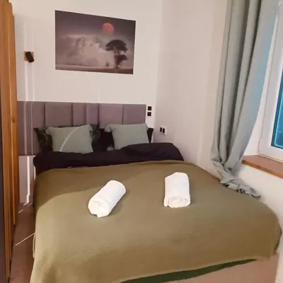 Łóżko lub łóżka w pokoju w obiekcie Studio z sauną