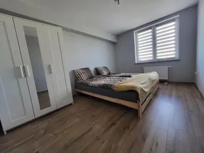Łóżko lub łóżka w pokoju w obiekcie ApartHotel9