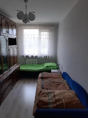Łóżko lub łóżka w pokoju w obiekcie Apartament Laurka