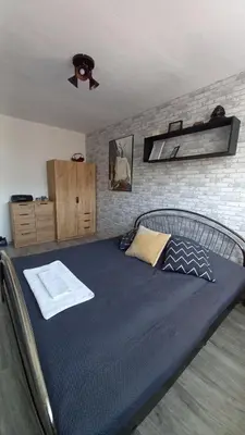 Łóżko lub łóżka w pokoju w obiekcie Na Dąbrówki