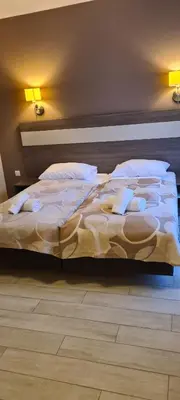 Łóżko lub łóżka w pokoju w obiekcie Apartamenty Czarna Góra T17