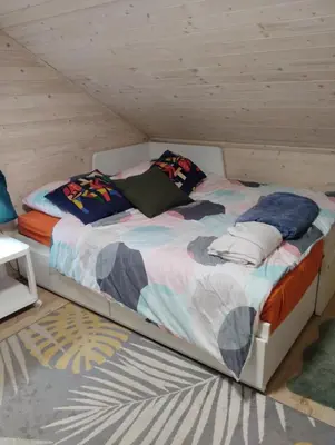 Łóżko lub łóżka w pokoju w obiekcie Dom nad wodospadem