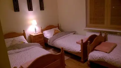 Łóżko lub łóżka w pokoju w obiekcie Apartament Familijny