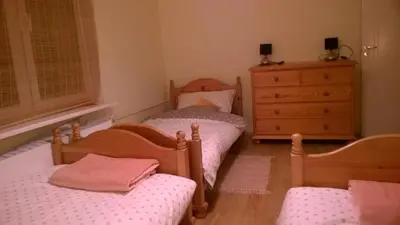 Łóżko lub łóżka w pokoju w obiekcie Apartament Familijny
