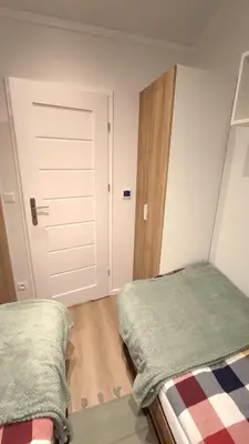 Łóżko lub łóżka w pokoju w obiekcie Domek Silver Moon na skraju rzeki