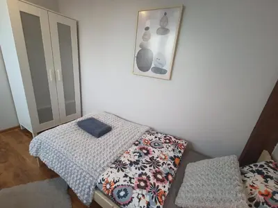 Łóżko lub łóżka w pokoju w obiekcie Lemuria Przytulny pokój Chojnowska