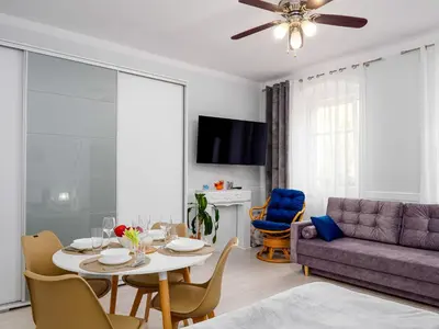 Telewizja i/lub zestaw kina domowego w obiekcie Apartament Greta