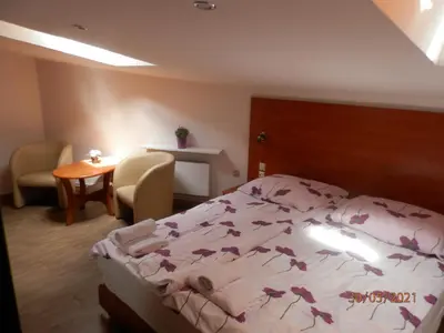 Łóżko lub łóżka w pokoju w obiekcie Usługi Noclegowe i Gastronomiczne dla Ludności Robert Mielcarek