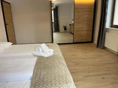 Łóżko lub łóżka w pokoju w obiekcie Dom na Słowiańskiej