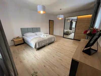 Łóżko lub łóżka w pokoju w obiekcie Dom na Słowiańskiej