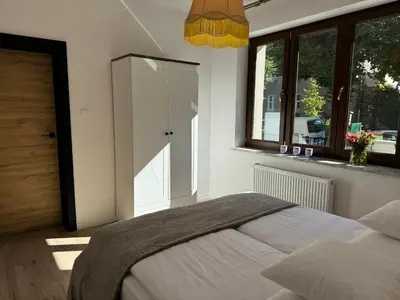 Łóżko lub łóżka w pokoju w obiekcie Dom na Słowiańskiej