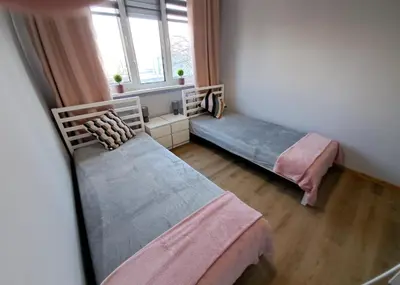 Łóżko lub łóżka w pokoju w obiekcie Apartament AQUA Centrum Borowska