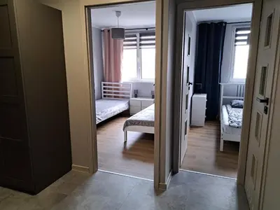 Łóżko lub łóżka w pokoju w obiekcie Apartament AQUA Centrum Borowska