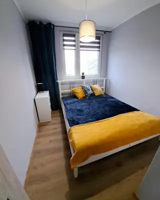 Łóżko lub łóżka w pokoju w obiekcie Apartament AQUA Centrum Borowska