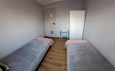 Łóżko lub łóżka w pokoju w obiekcie Apartament AQUA Centrum Borowska