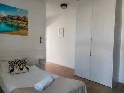 Łóżko lub łóżka w pokoju w obiekcie AmaMolto Apartamenty - Włoskie Inspiracje