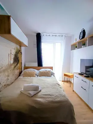 Łóżko lub łóżka w pokoju w obiekcie AmaMolto Apartamenty - Włoskie Inspiracje