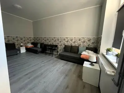 Część wypoczynkowa w obiekcie Duży Apartament - Stare Miasto - 12 osób - 6 łóżek