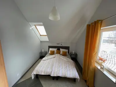 Łóżko lub łóżka w pokoju w obiekcie Apartamenty Świerkowa #1