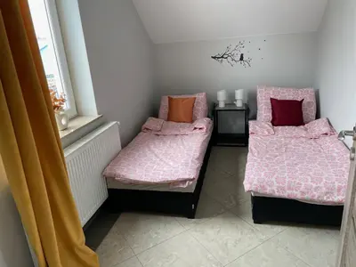 Łóżko lub łóżka w pokoju w obiekcie Apartamenty Świerkowa #1