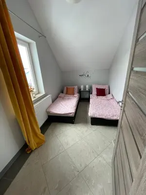 Łóżko lub łóżka w pokoju w obiekcie Apartamenty Świerkowa #1
