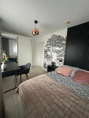 Łóżko lub łóżka w pokoju w obiekcie Zielona Góra Apartament