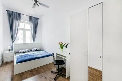 Łóżko lub łóżka w pokoju w obiekcie Loft City Center Apartments- Parking, Wifi, 24h Check-In