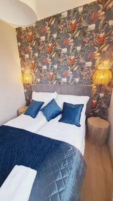 Łóżko lub łóżka w pokoju w obiekcie Apartament 31 z Sauną Rowery, Spacery w Dolinie Baryczy - 5D Apartamenty