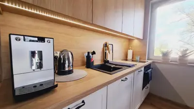 Kuchnia lub aneks kuchenny w obiekcie Apartament 31 z Sauną Rowery, Spacery w Dolinie Baryczy - 5D Apartamenty