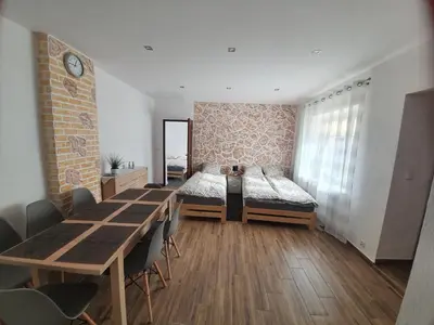 Łóżko lub łóżka w pokoju w obiekcie Apartament Mickiewicza