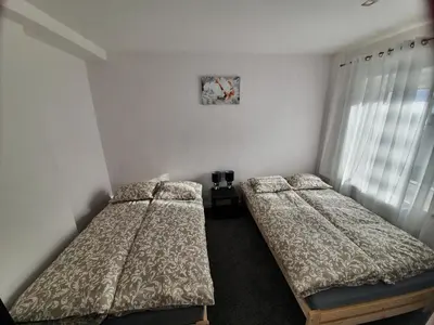 Łóżko lub łóżka w pokoju w obiekcie Apartament Mickiewicza