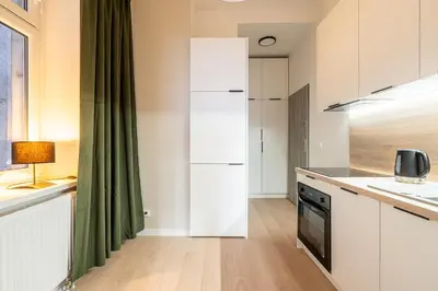 Kuchnia lub aneks kuchenny w obiekcie RentPlanet - Apartamenty Śródmieście